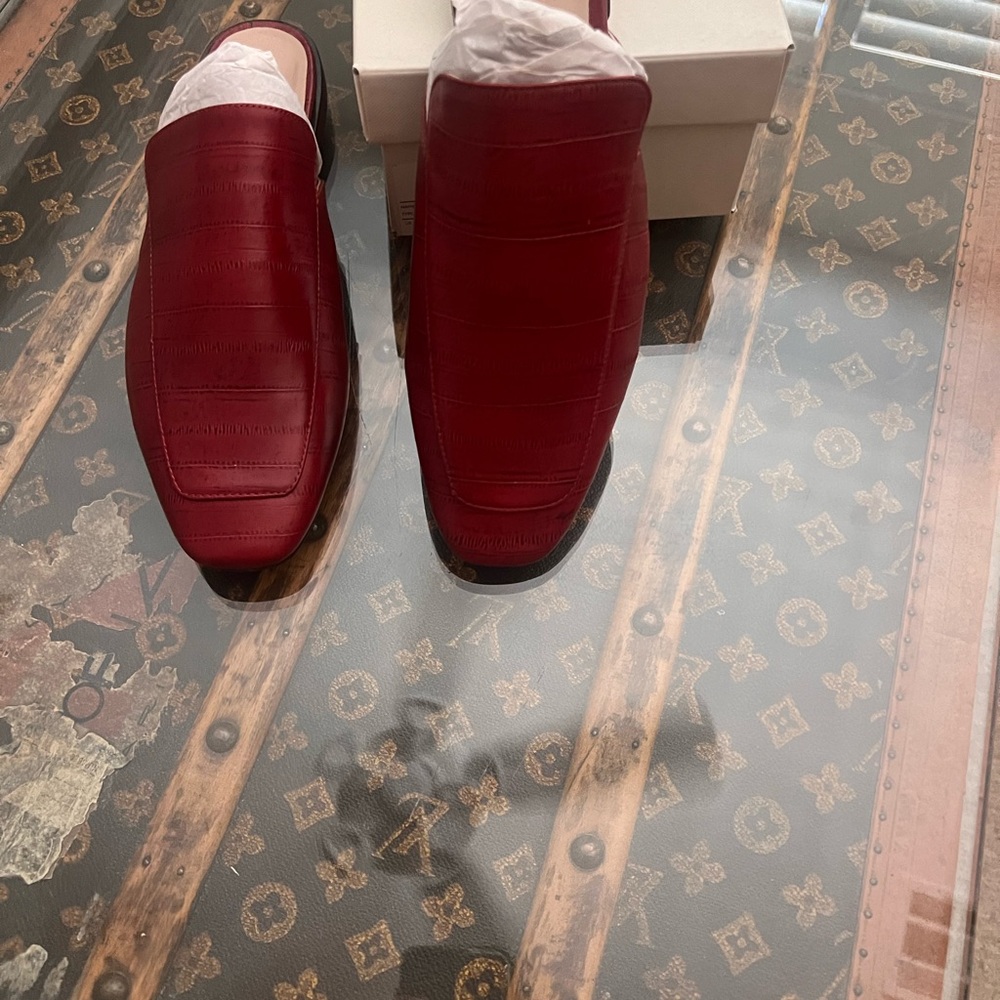 Red snake print leather mule . Brand new in box . Never worn .